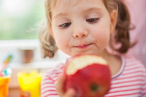 girl eating an apple